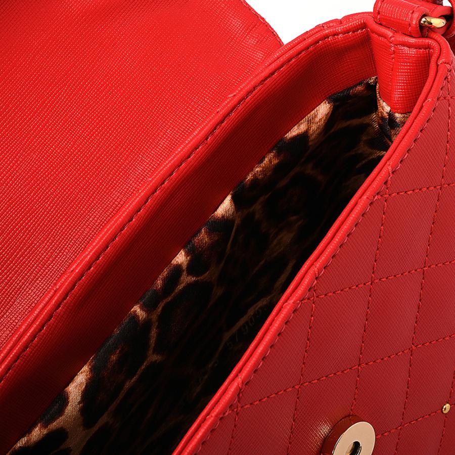 CARTERA CON APLIQUES DE METAL